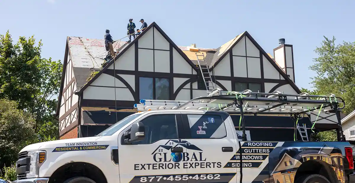 Global Exterior Experts truck in front of home remodeling project.
