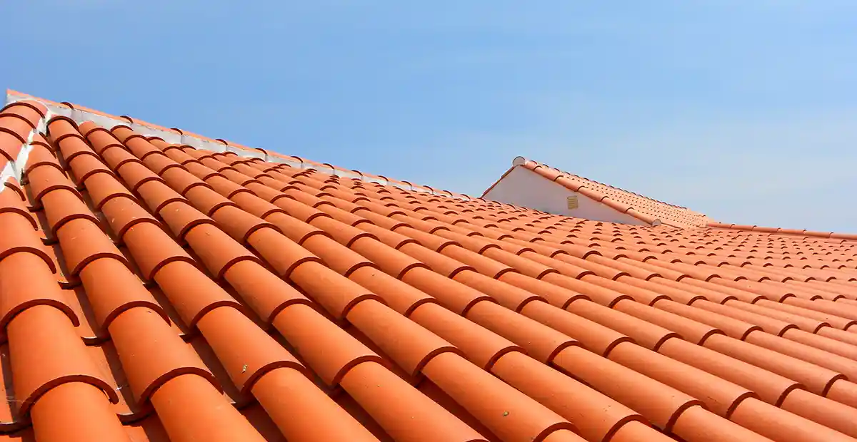 Orange tile roof on home.