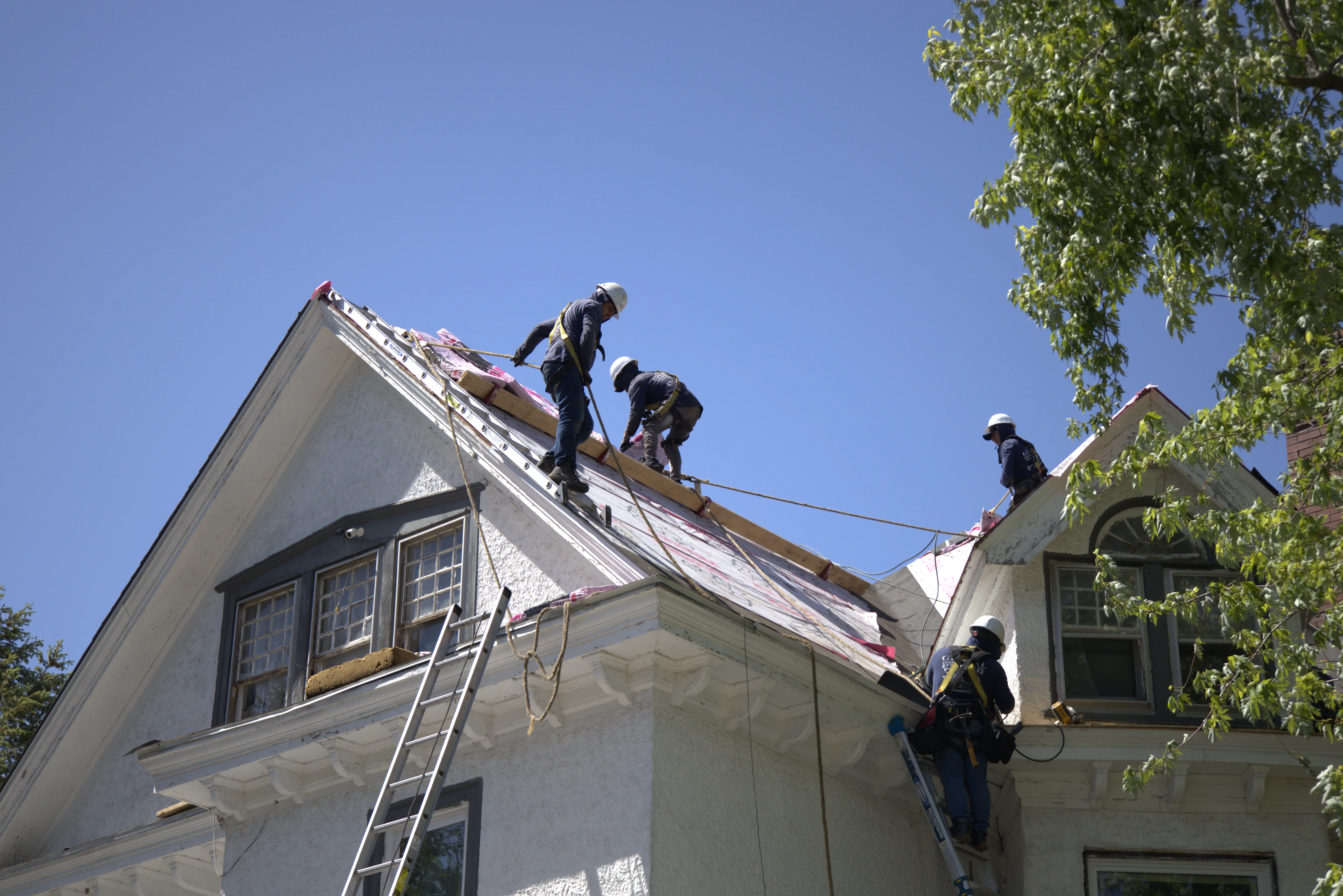 Global Exterior Experts Roofers Ontop of Residential Roof For Roof Replacement