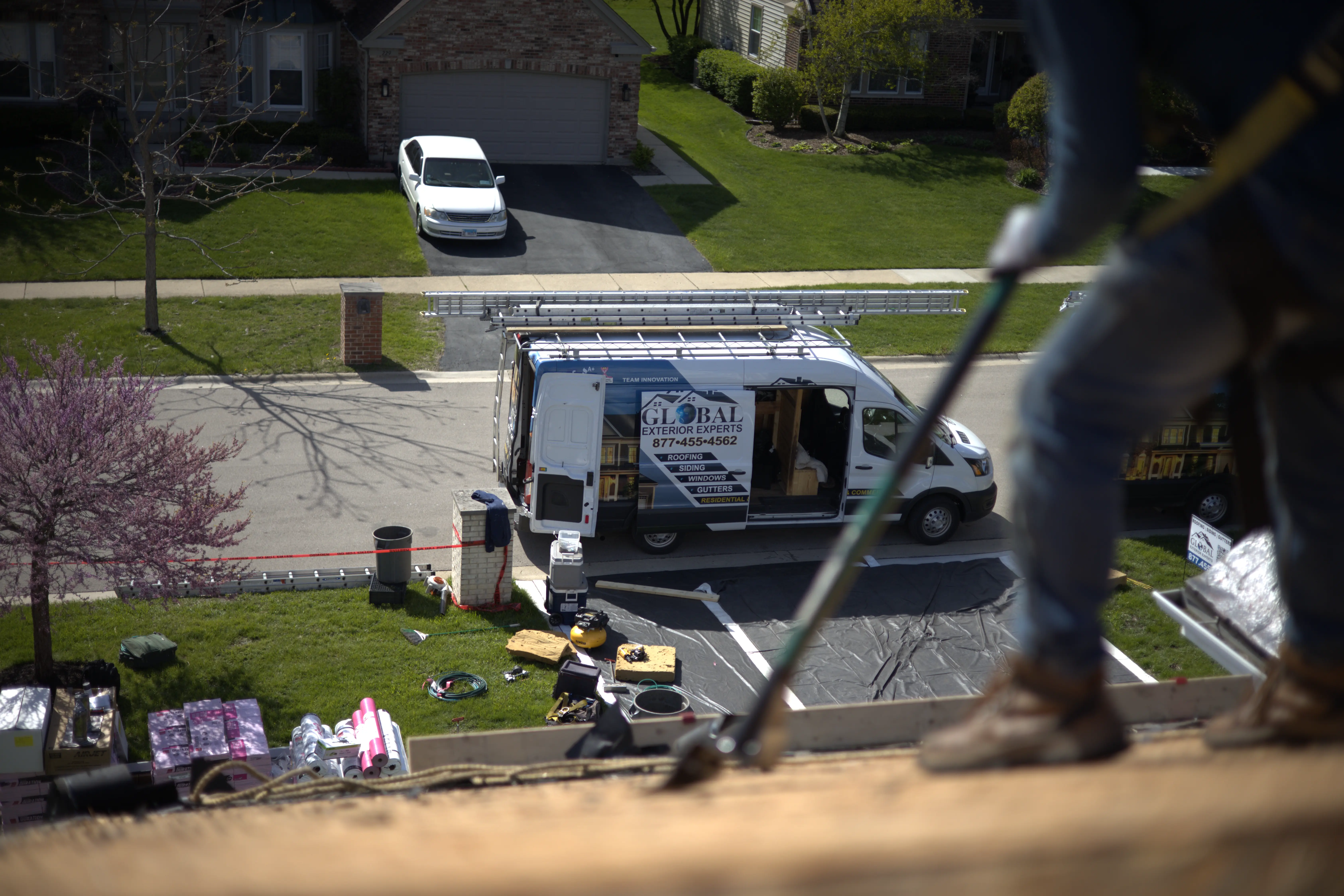 Shingles being Torn Off By A Global Exterior Experts