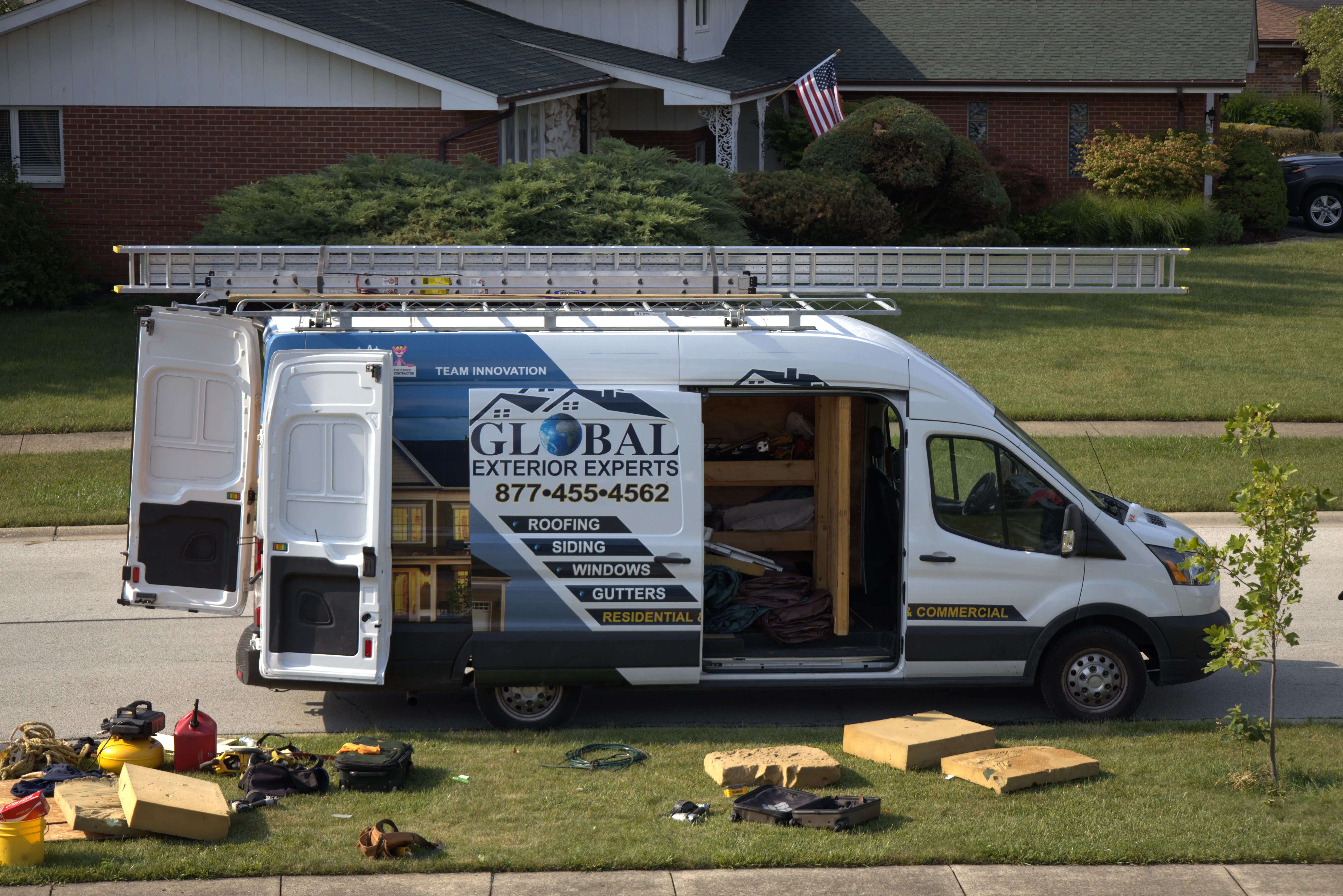 Global Exterior Experts Van Opened With All Equipment On The Ground For Residential Roof Replacement
