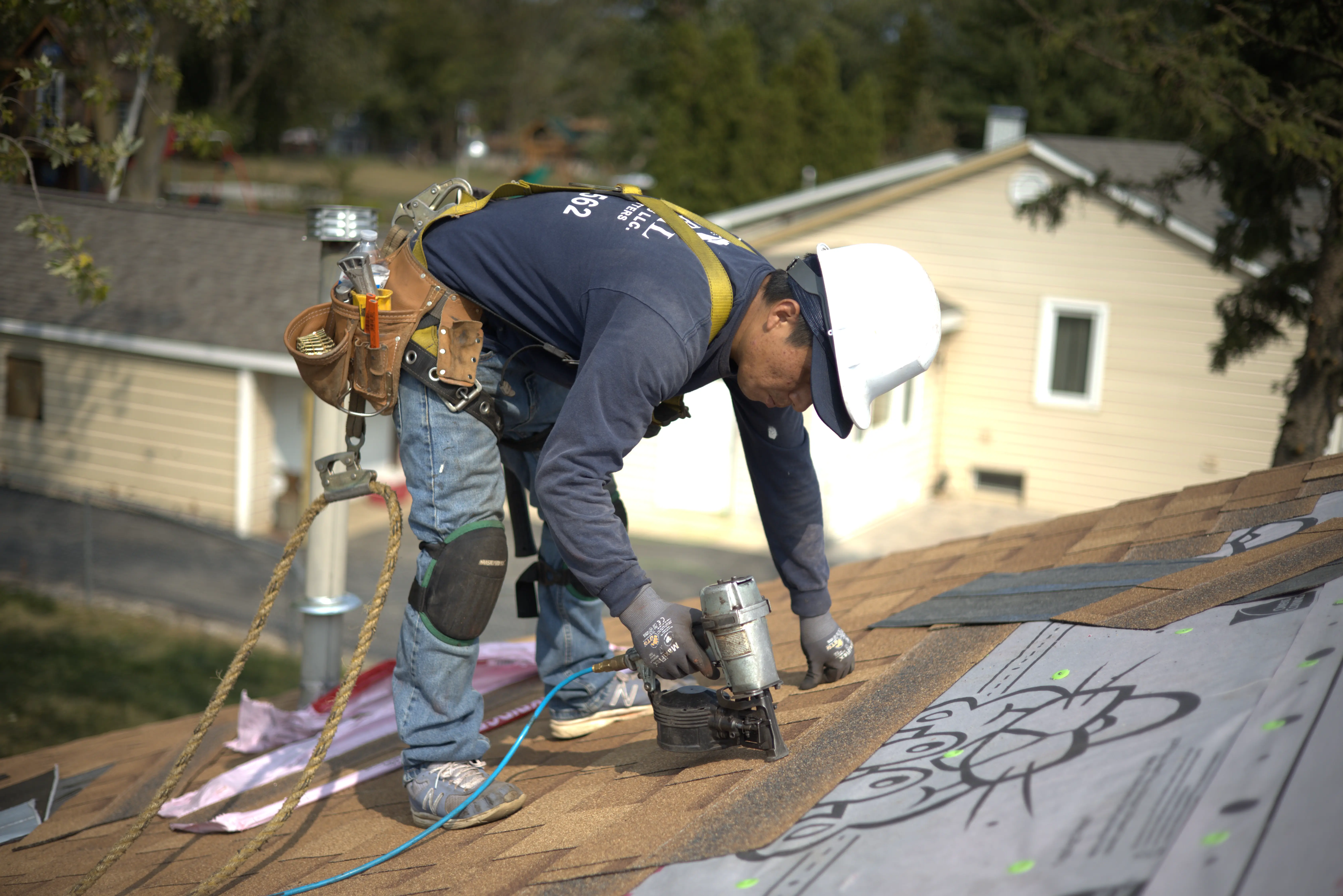 Global Exterior Experts Roofer Installing Shingle Roof