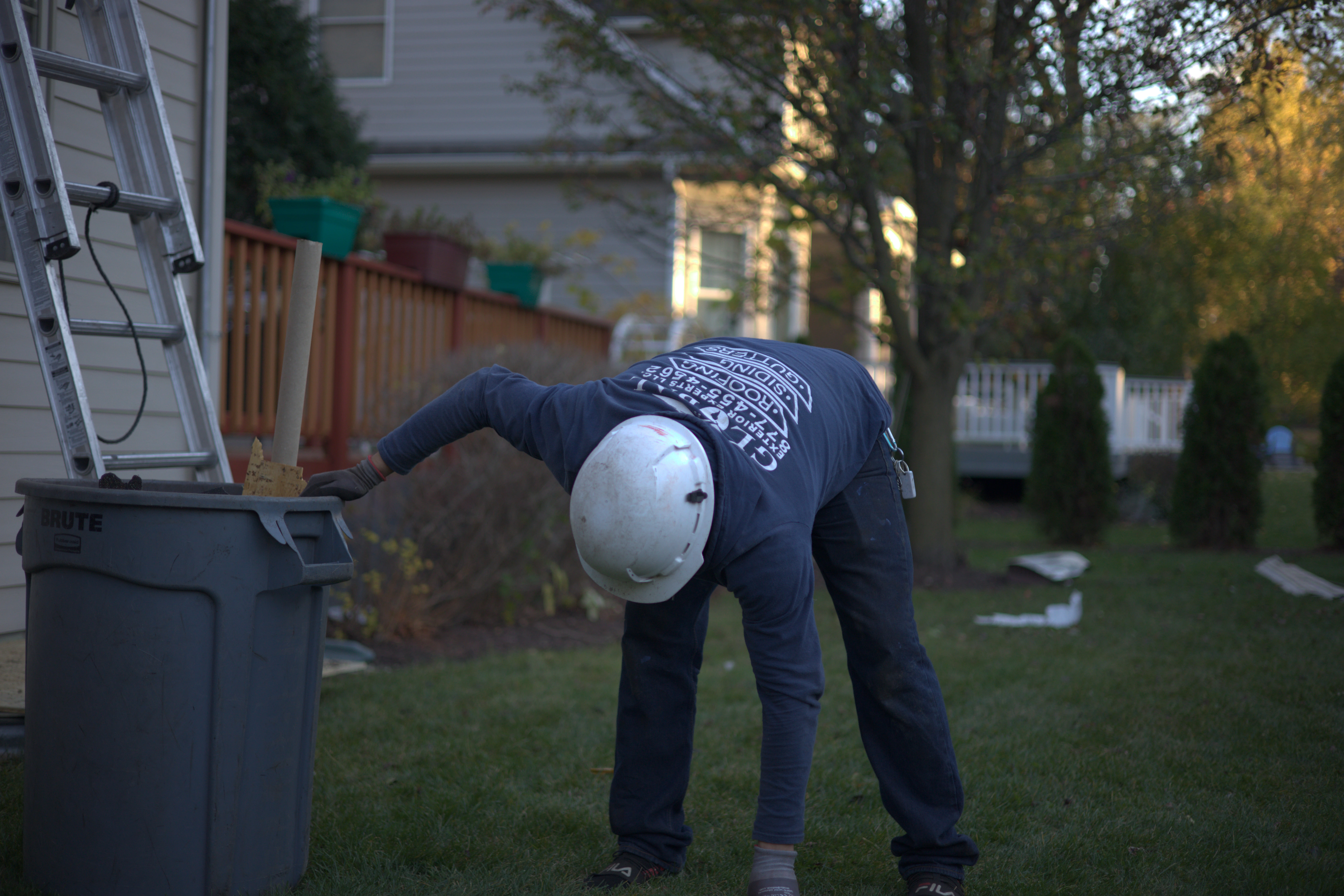 Global Exterior Experts Cleaning Up After Residential Roof Replacement