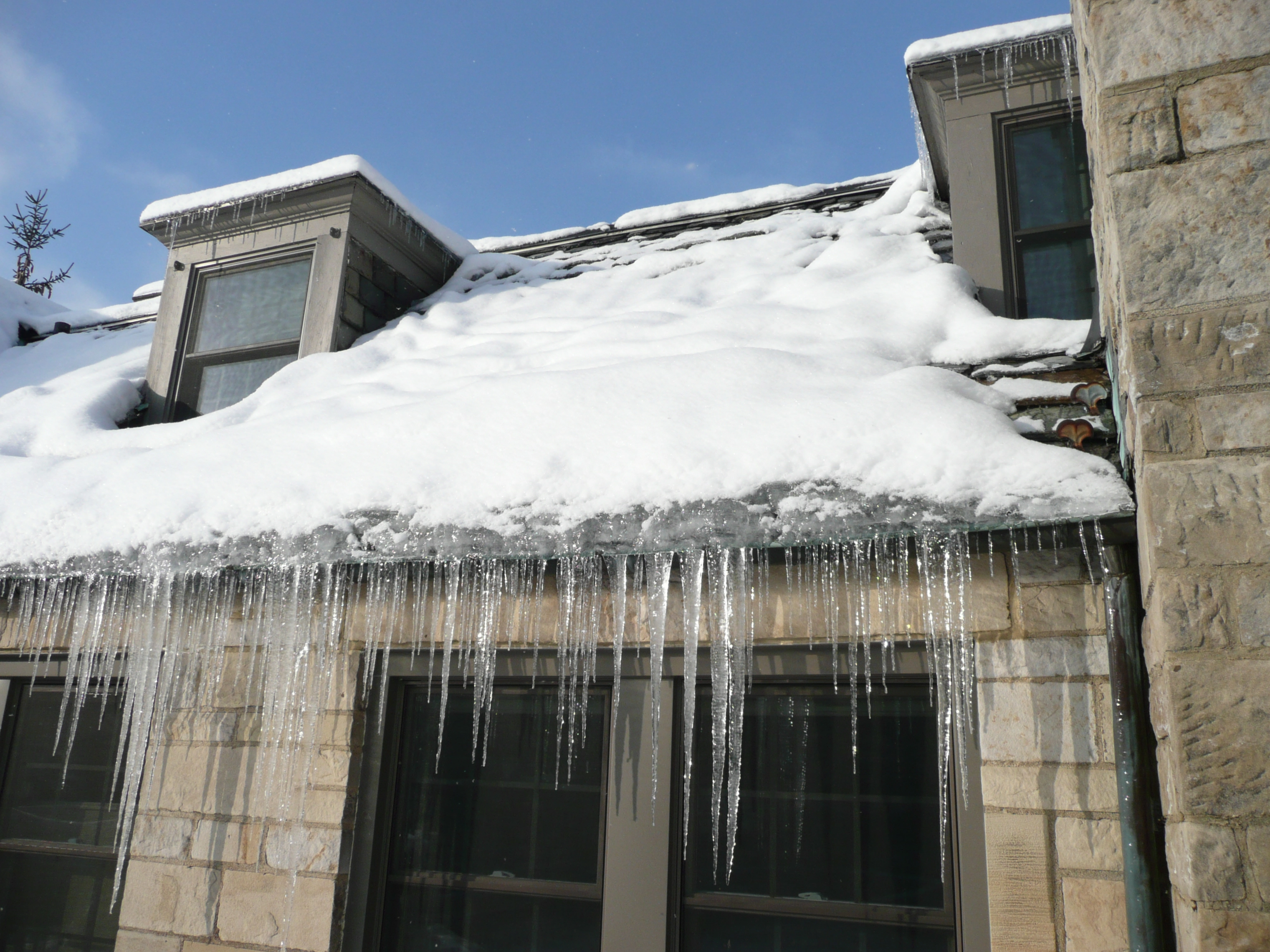 Residential Roof With Ice Dam On It