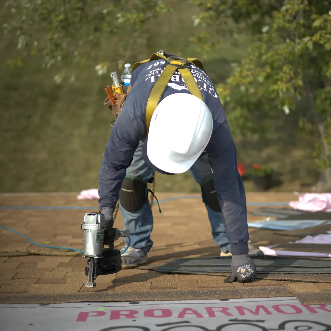 Global Exterior Experts Roofer Installing Owen's Corning Shingles over owen's corning underlayment on a residential roof