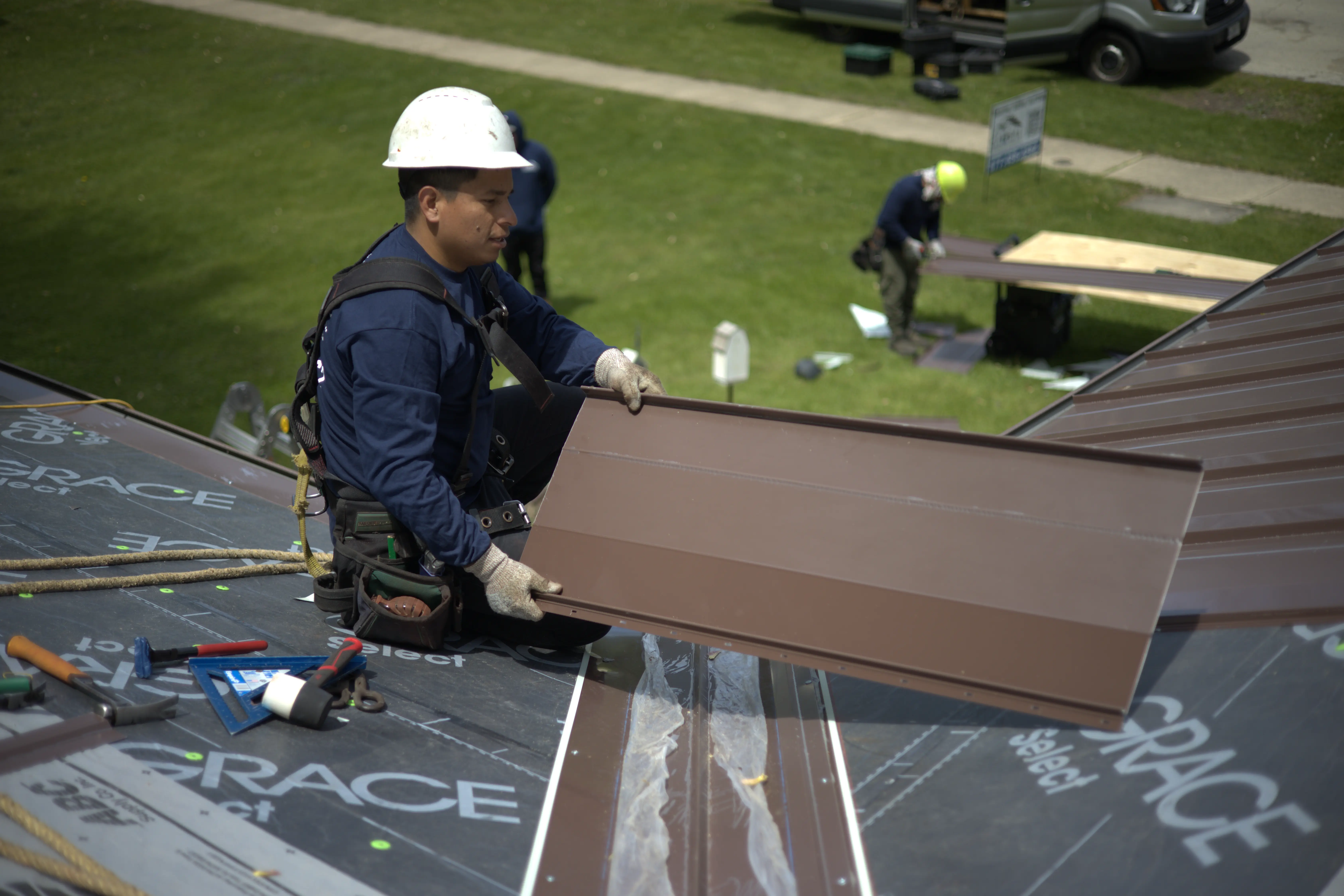 Global Exterior Experts Roofer Showing Off Metal ROof Panel