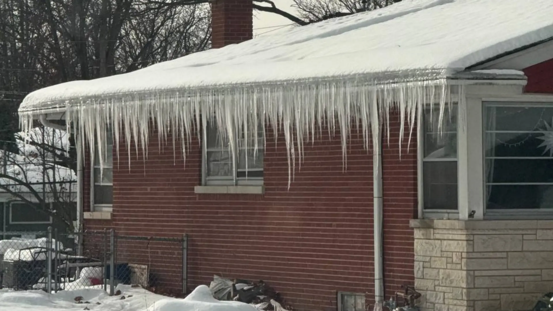 Lots of icicles on residential home seeping