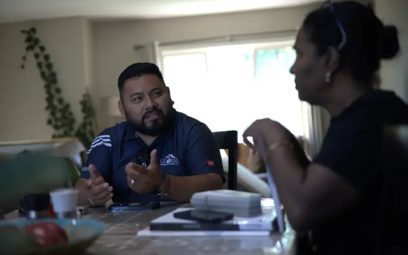 Aaron Venegaz Speaking With Homeowner about an insurance claim and roof replacement