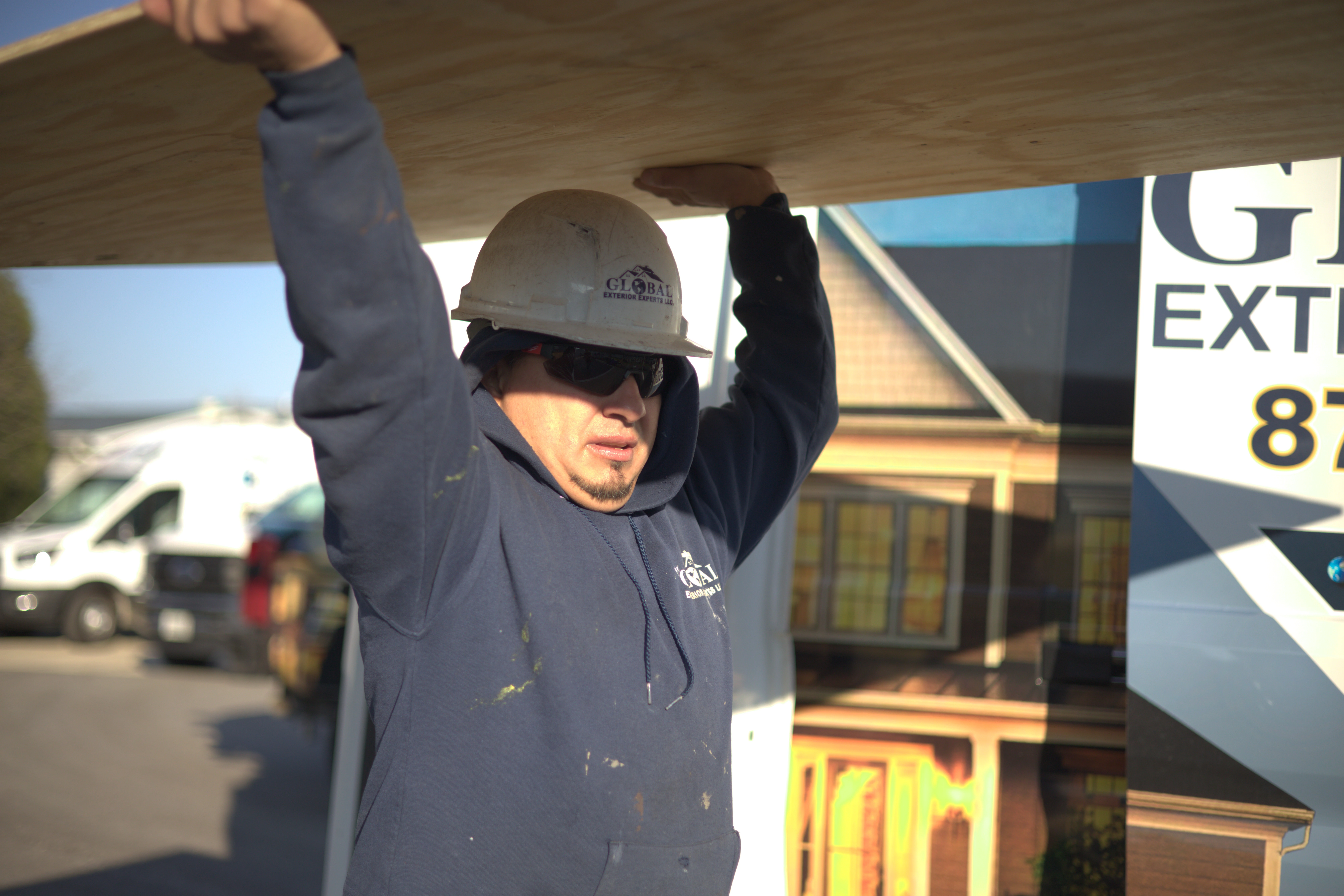 Carrying Plywood Decking To Be Replaced On Residential Roof