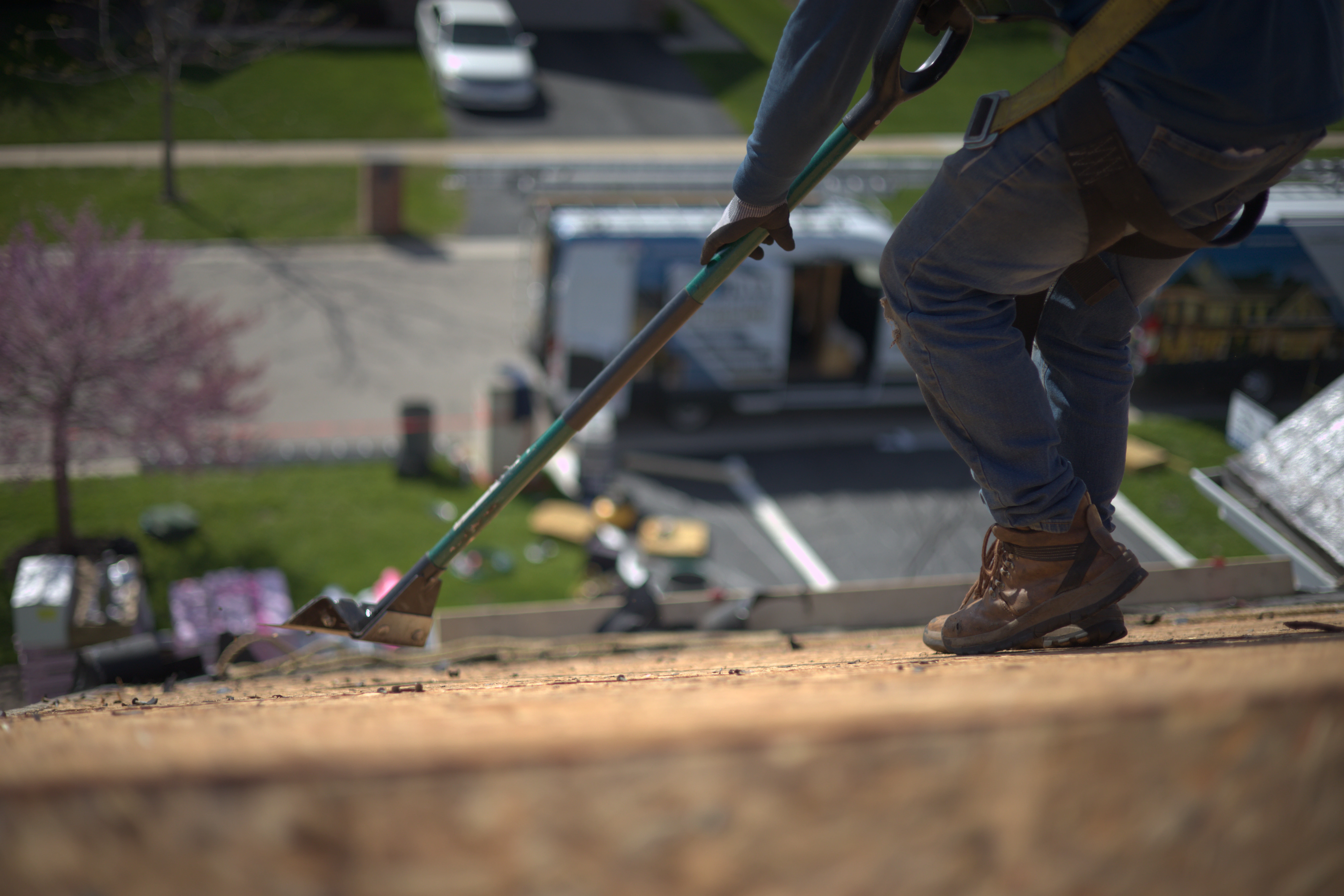 Tearing Off Roof With Nail Puller For Residential Roofing Project
