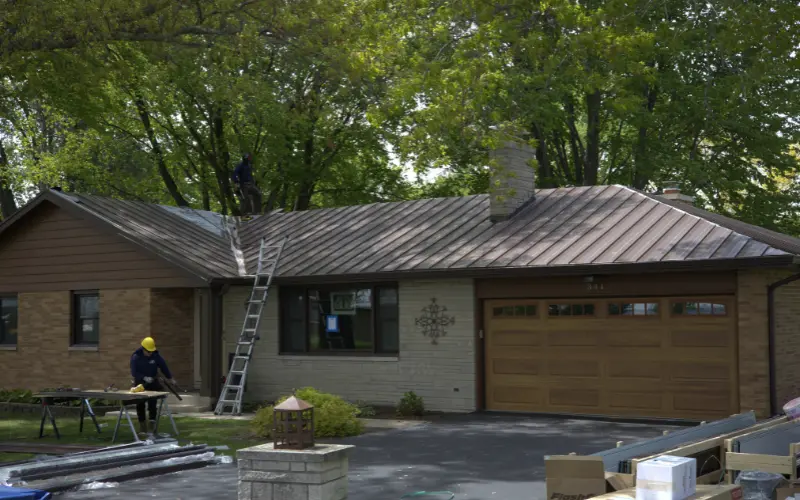 Brown Metal Roof Being Installed On One Story Residential Home