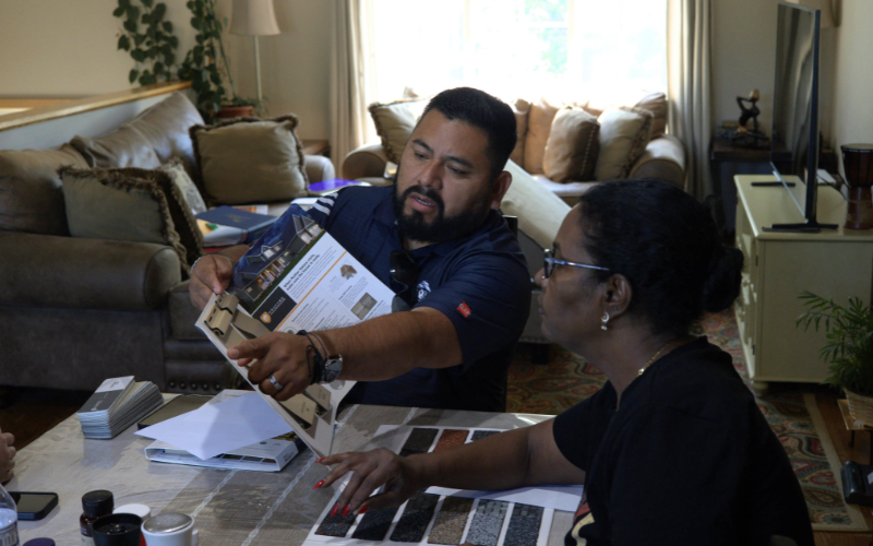 Aaron Venegaz from Global Exterior Experts guiding a client through the replacement process