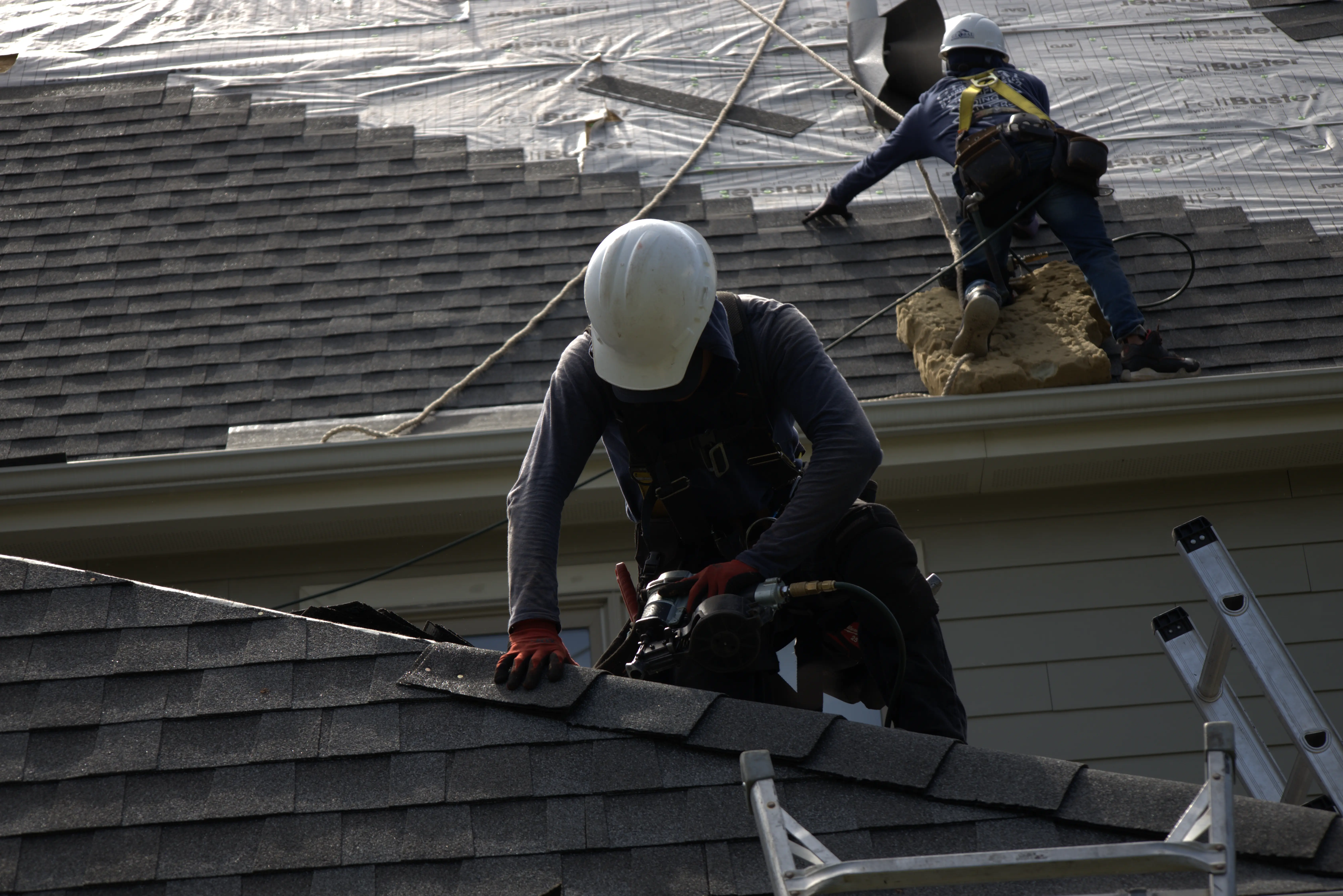 Asphalt Shingle Being Installed On A Residential Roof