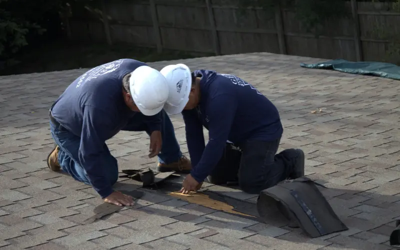 Two Roofer Doing Emergency Roof Repair