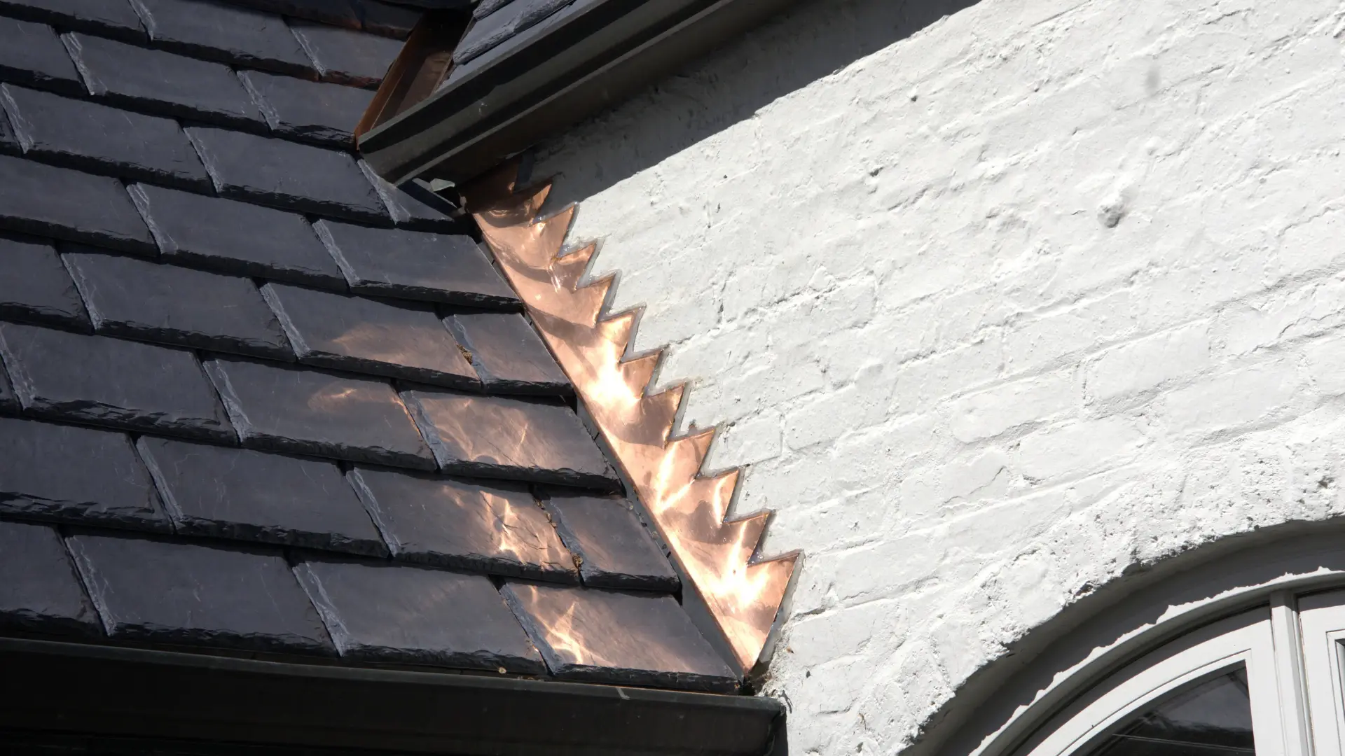 Copper Step Flashing On Residential Home With Slate