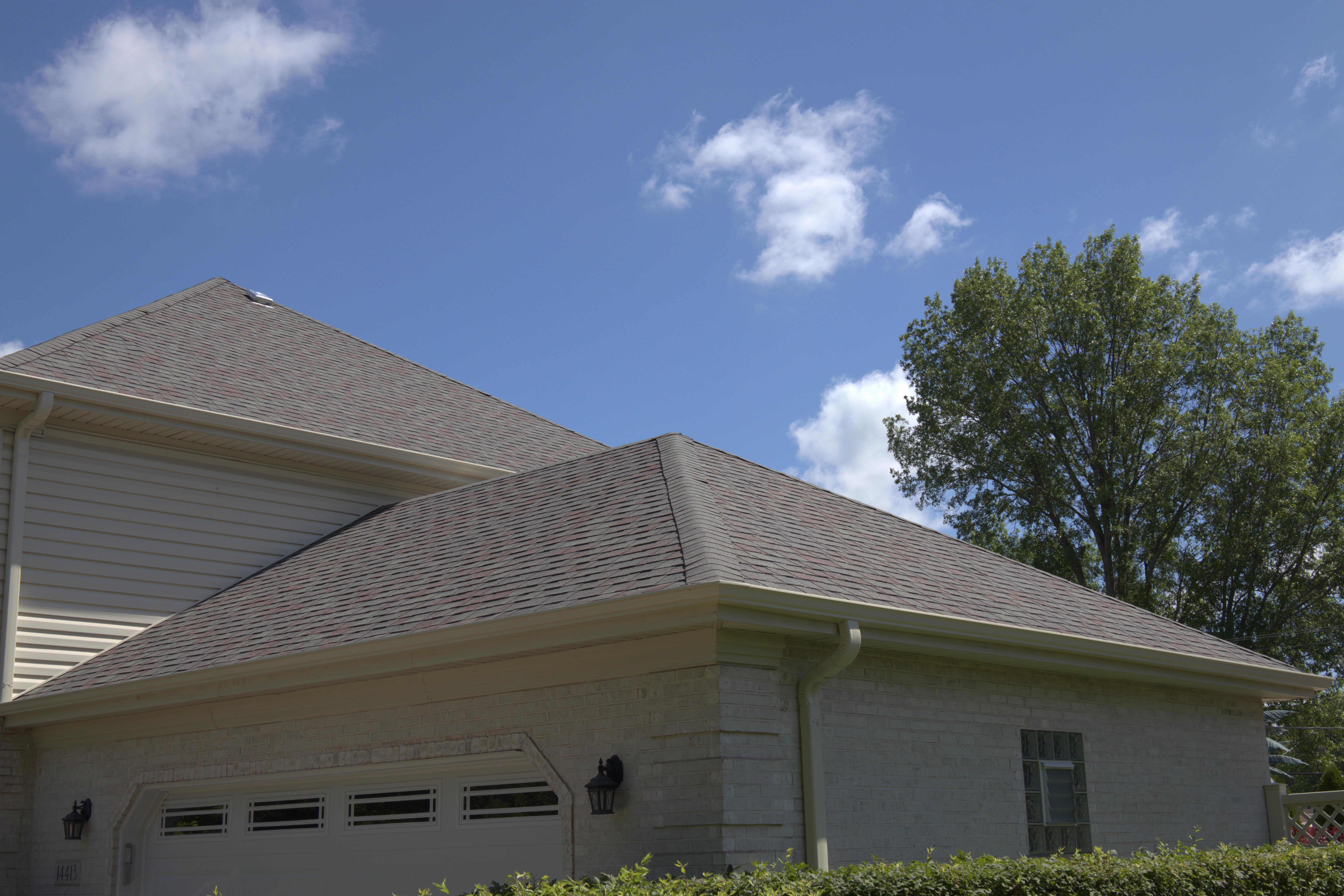 Residential Roof With Fresh Roof On It