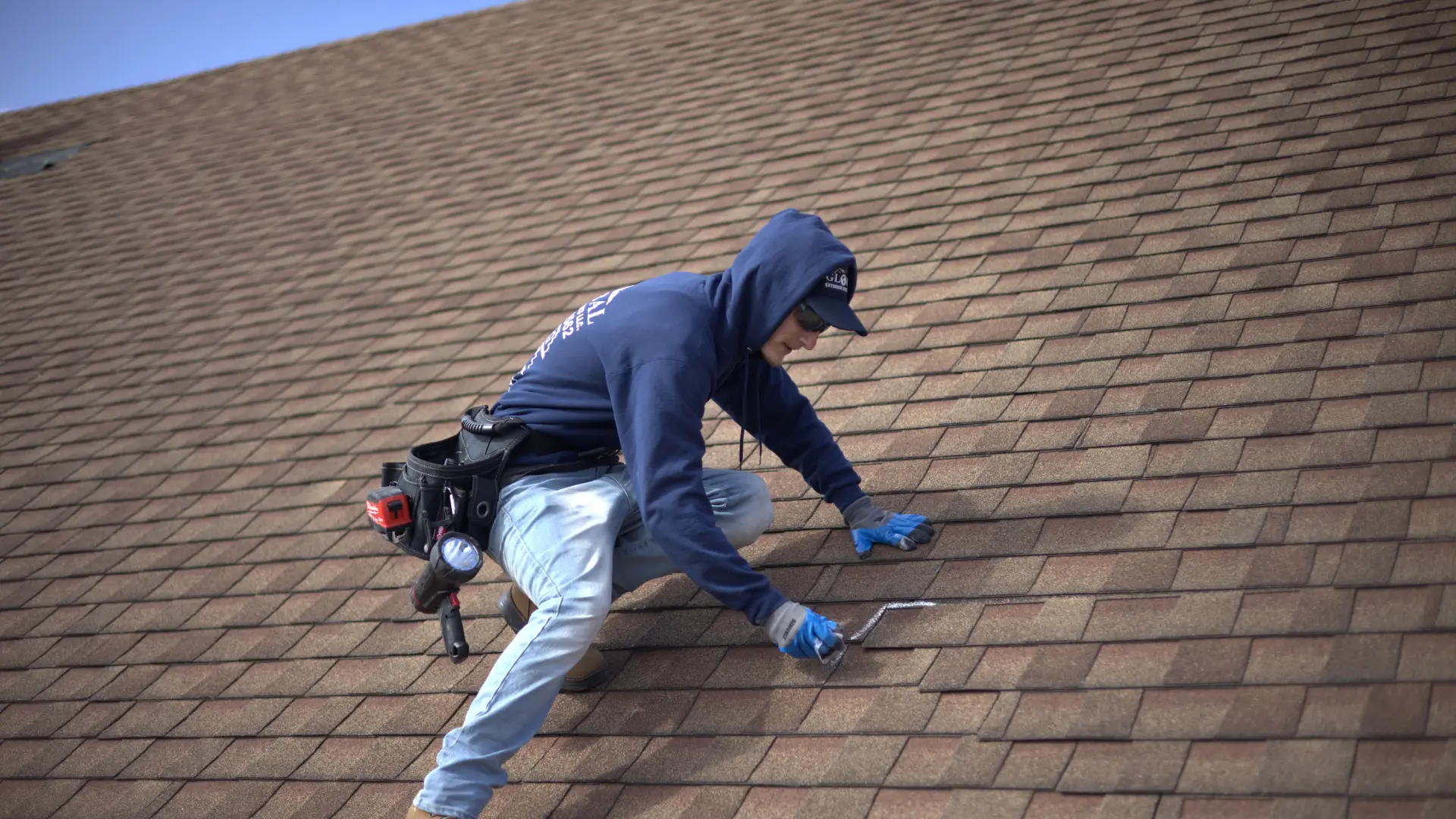 Trusted Roofing Inspector marking Down wind and hail damages shingles