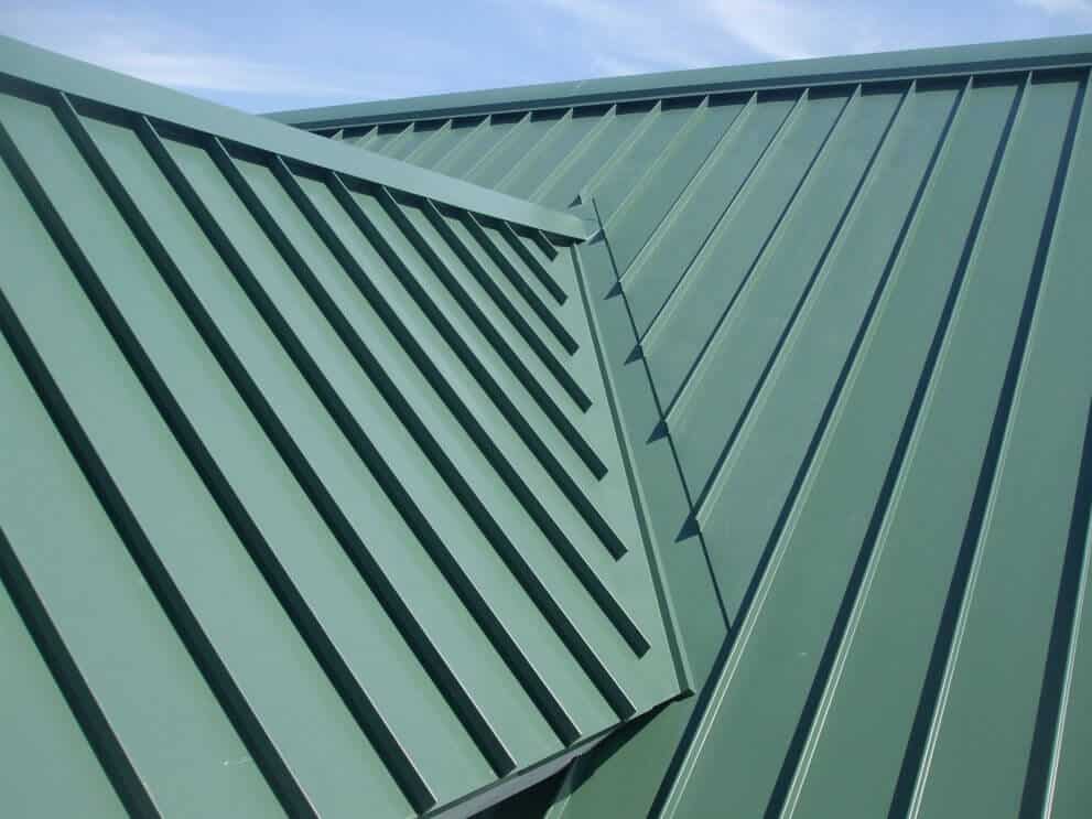 Narrow roofing panels on mixed-use facility complement batten siding