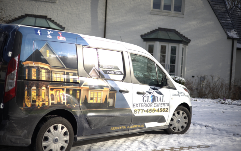 Global Exterior Experts Van In Snow Infront Of Past Project