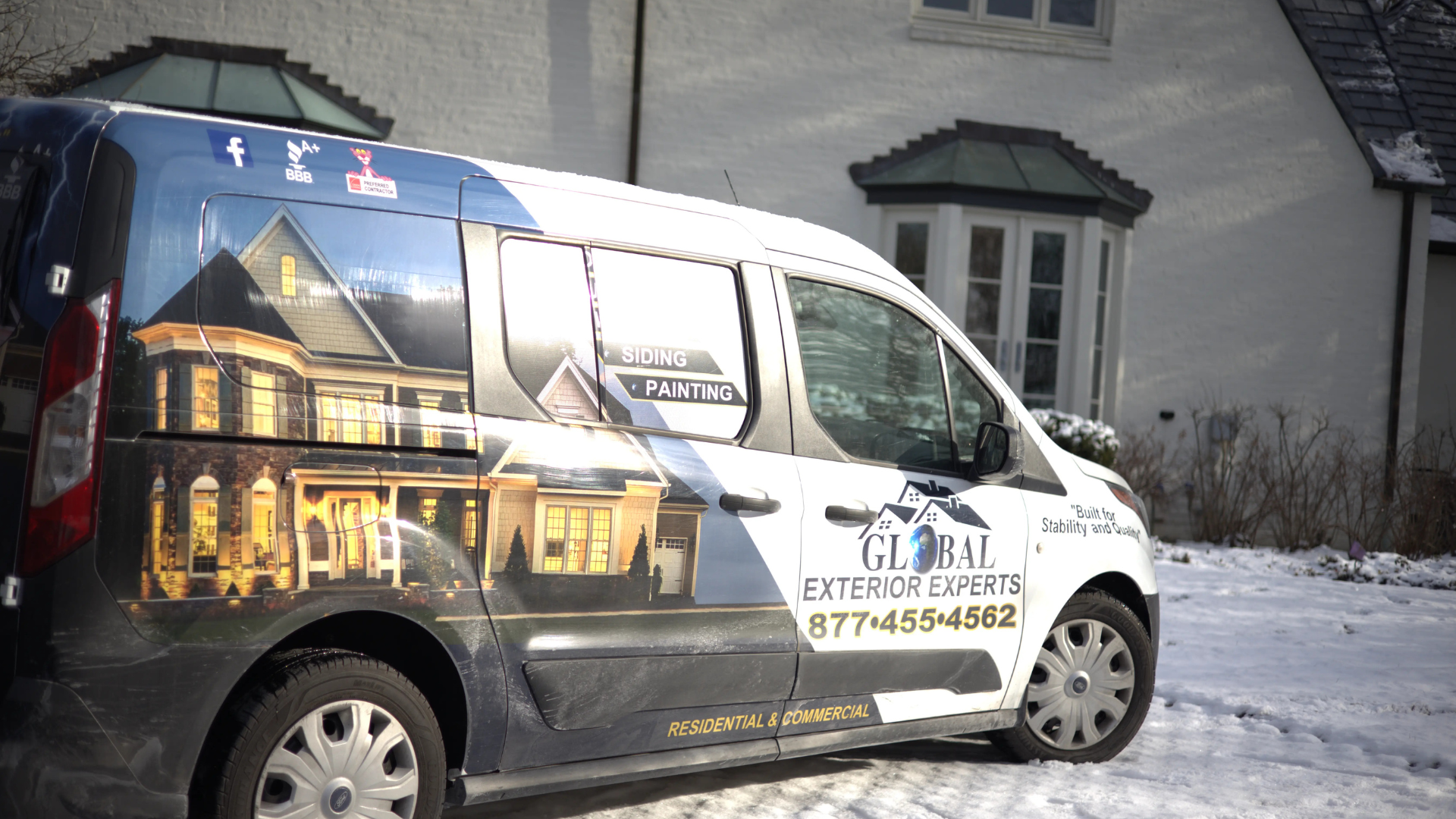 Global Exterior Experts Van In Snow Infront Of Past Project