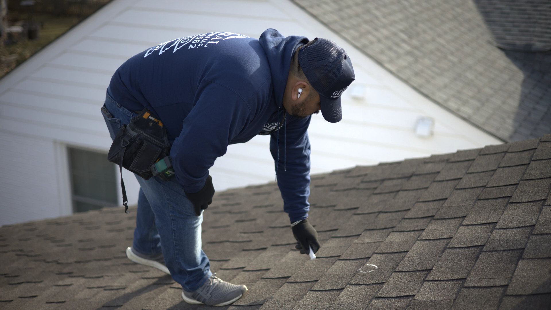Roofer Marking Up Roof