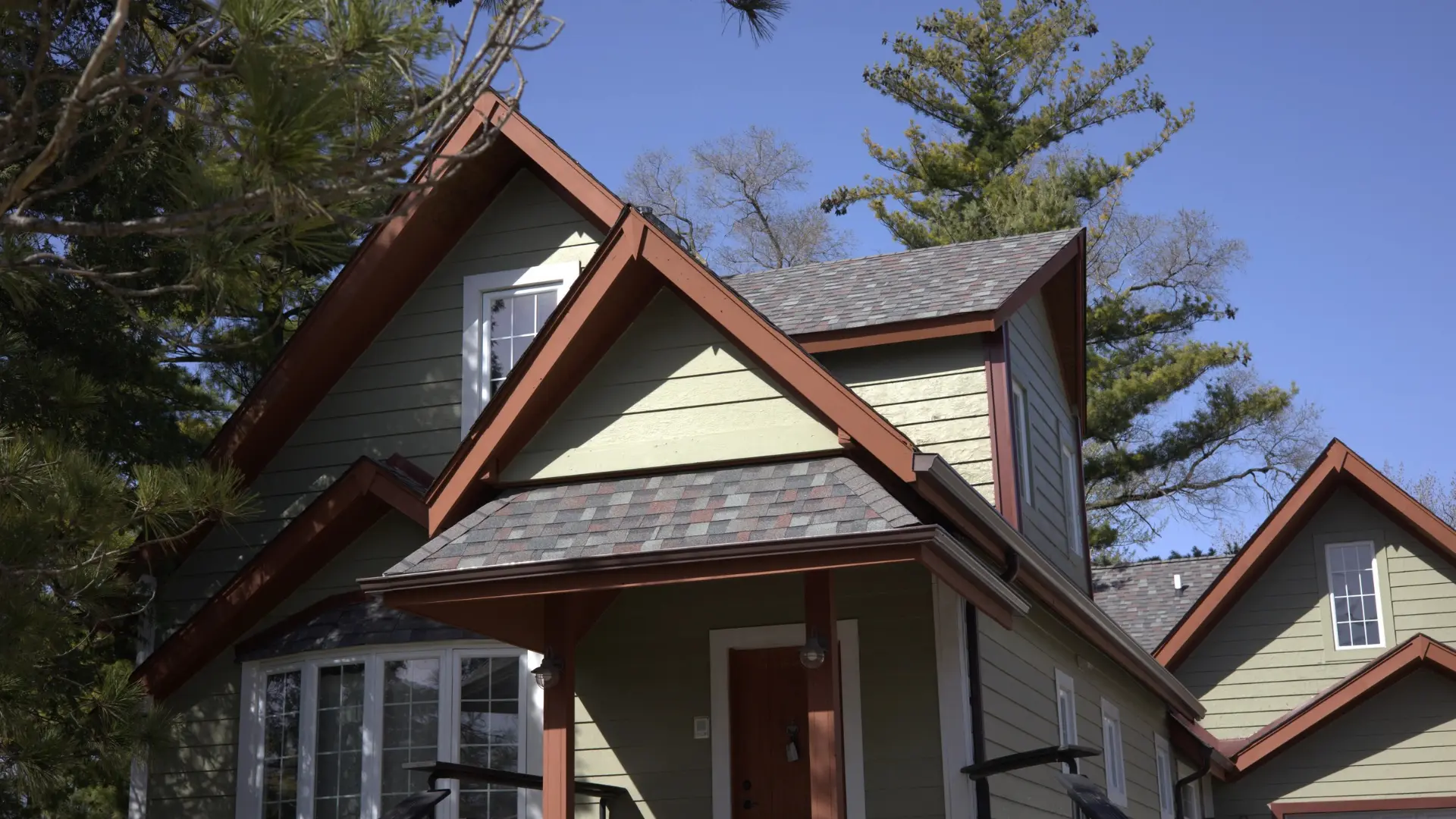 A very nice grey roof with new shingles on a residential home