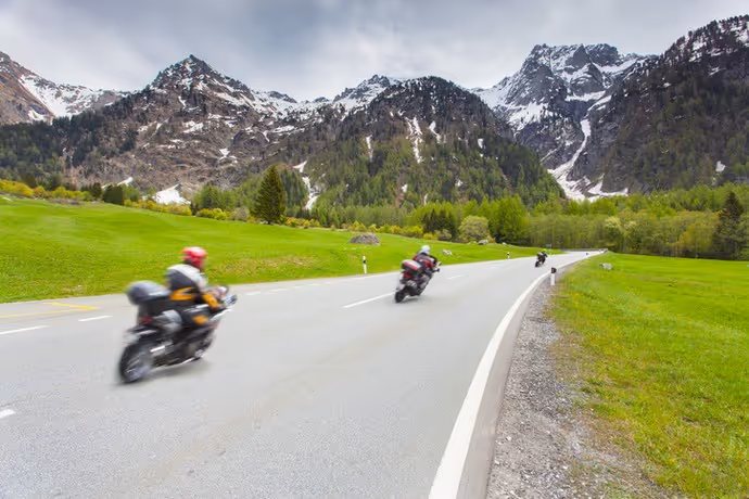 three motorbikes on a mountain road