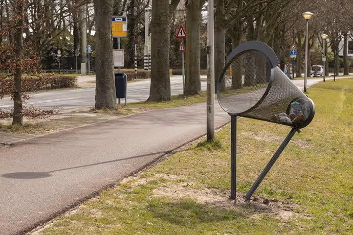 angled rubbish container for cyclists