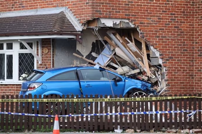 car crashed into house