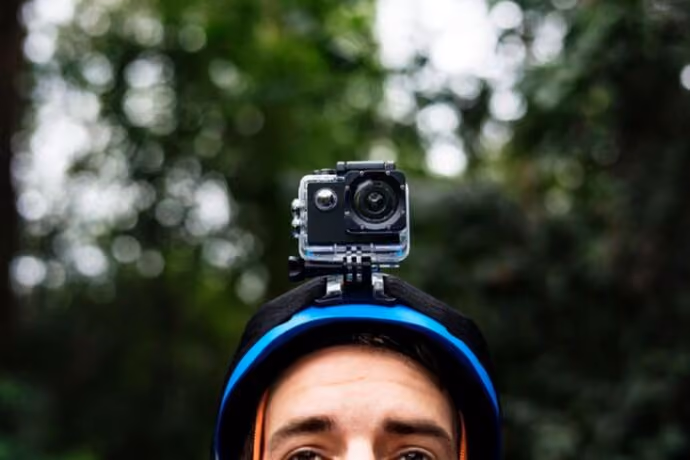 man wearing cycle helemt fitted with camera