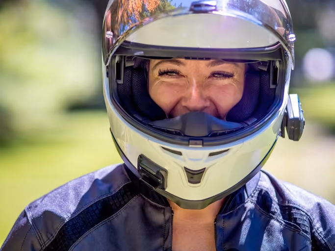 close-up of motorcyclist wearing a helmet equipped with an intercom system 