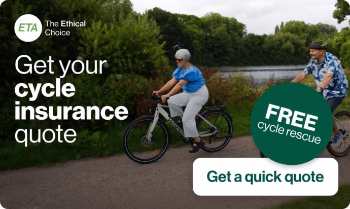 two cyclists riding e-bikes beside river in British countryside 