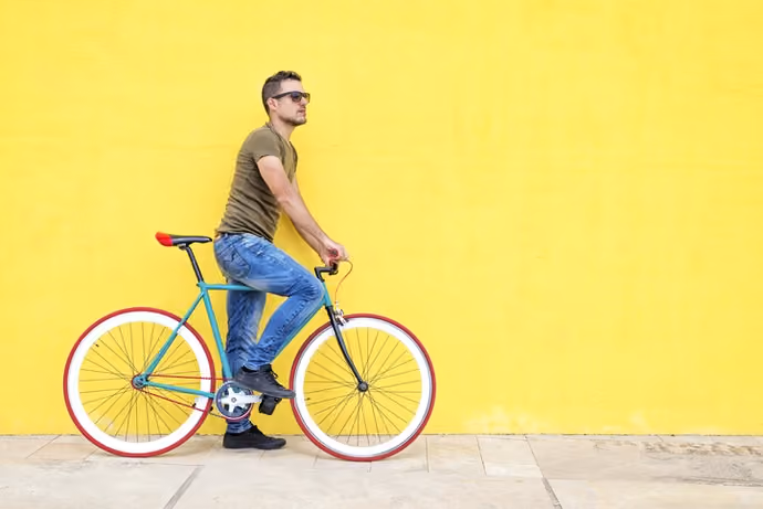 main standing next to singlespeed bicycle
