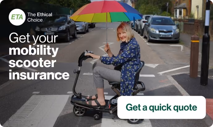older lady on mobiltiy scooter holding colourful umbrella while crossing road in London