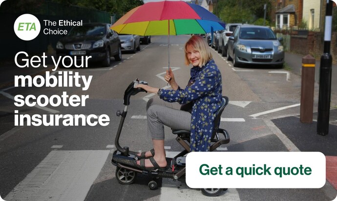older lady on mobiltiy scooter holding colourful umbrella while crossing road in London 