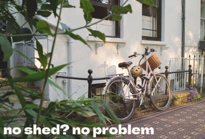 bicycle locked to railings at the front of a house in London