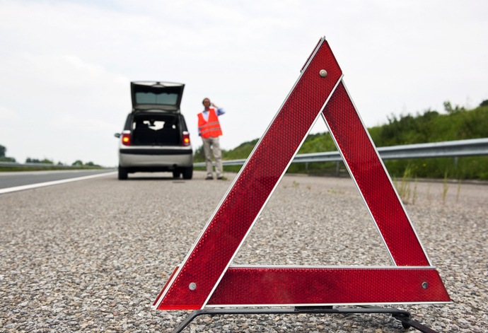 Road side warning triangle, warning traffic of a brokendown car on French motorway