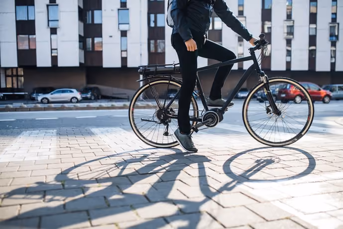 man with e-bike on a city street