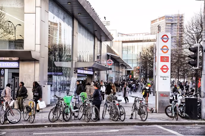 Row of bicycles parked outside London railway station