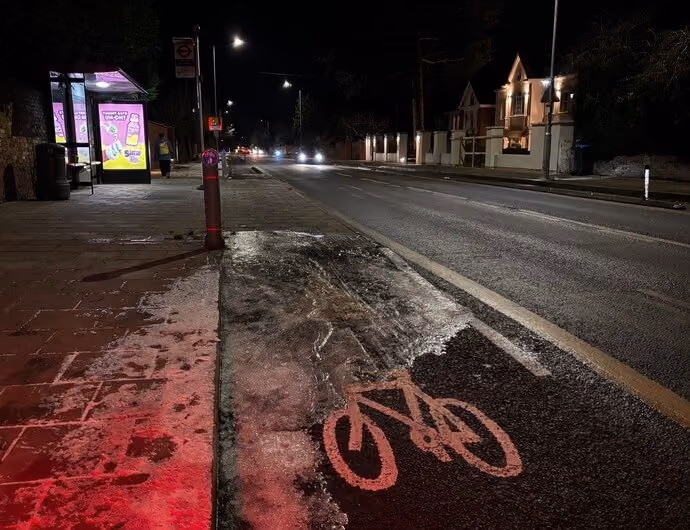 treacherous patch of ice on cycle lane at night in London