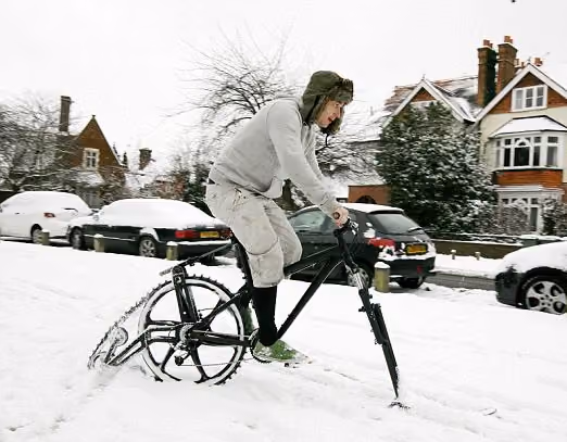 snow bike with caterpillar tracks being ridden in London