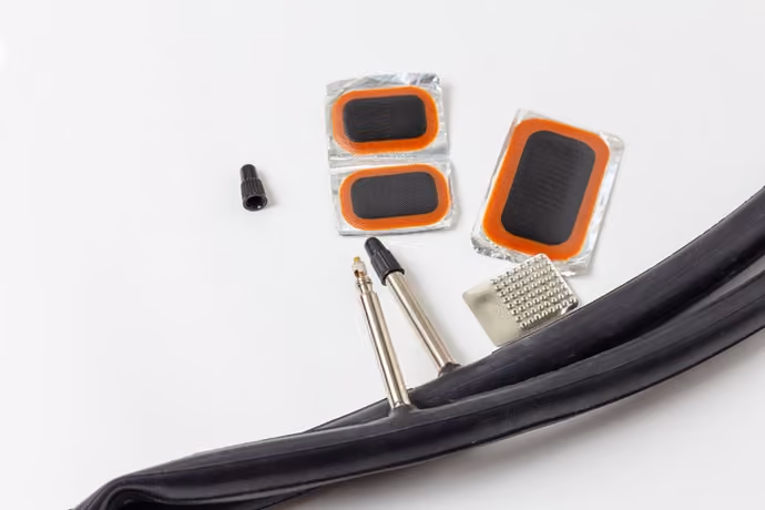 puncture repair kit pictured next to inner tube