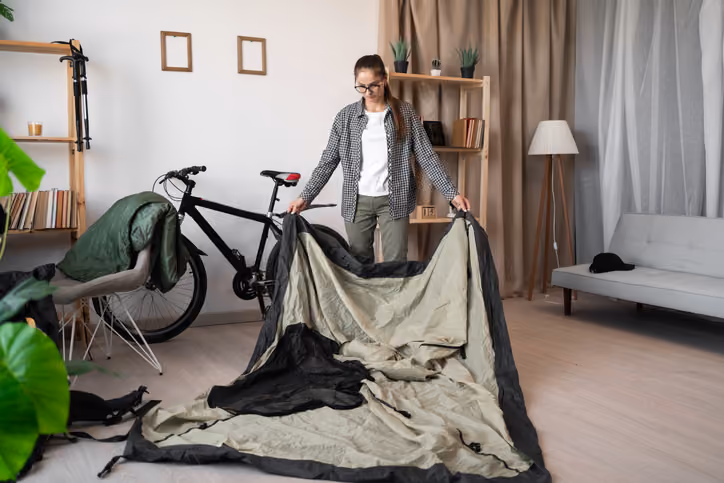 woman packing for cycle touring trip