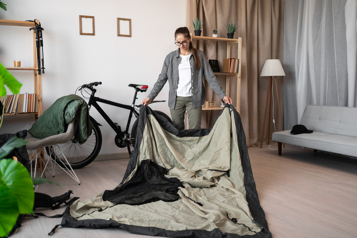 woman packing for cycle touring trip