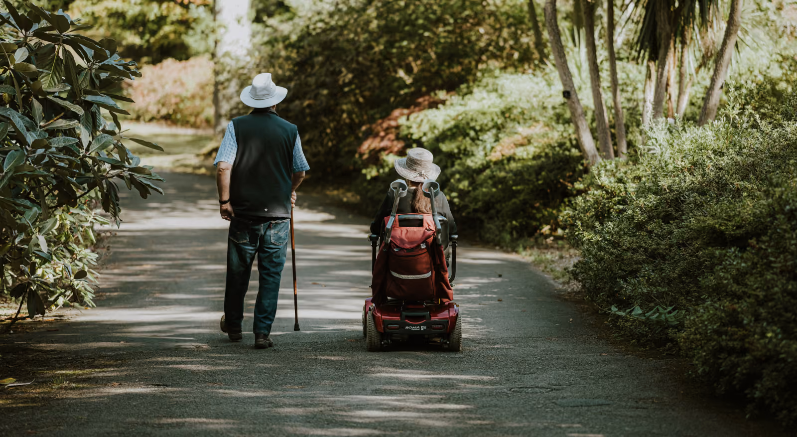 Elderly couple with mobility scooter