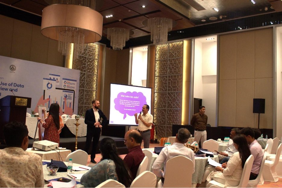 A group of people in a roomAI-generated content may be incorrect.