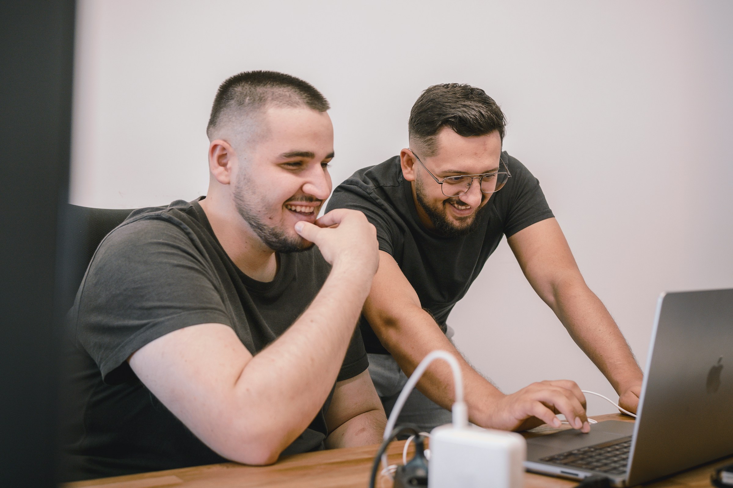 men smiling - Using AI To Write Essays