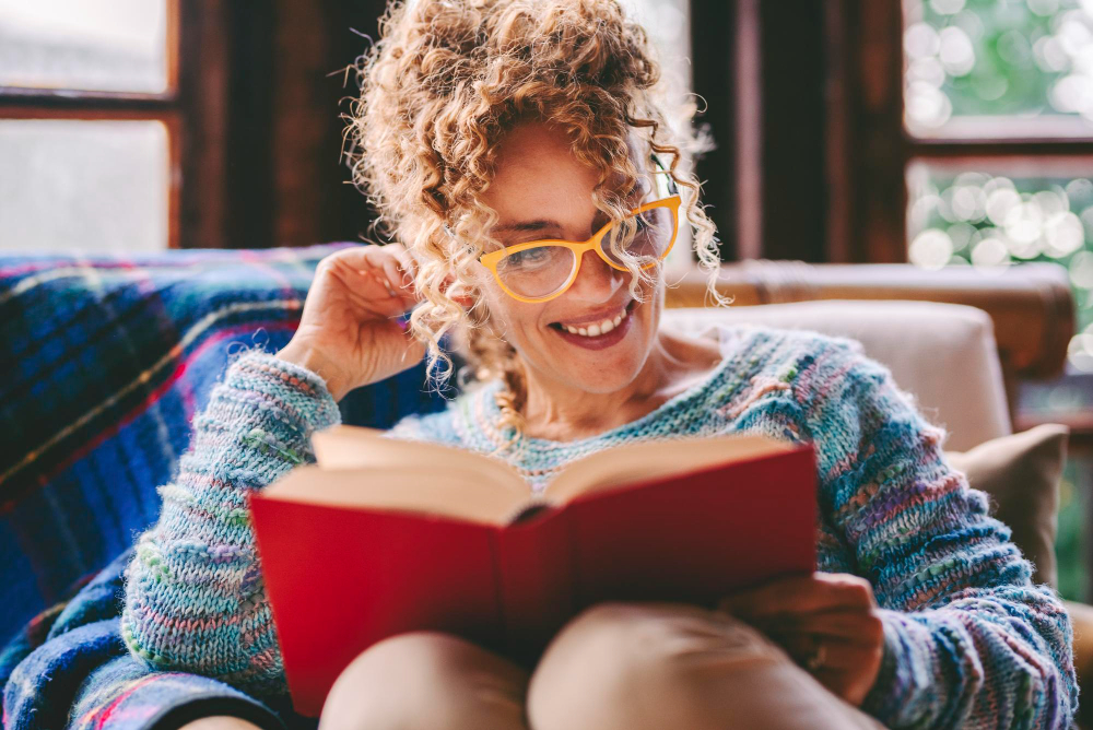 woman reading a book - How To Write The Best College Essay