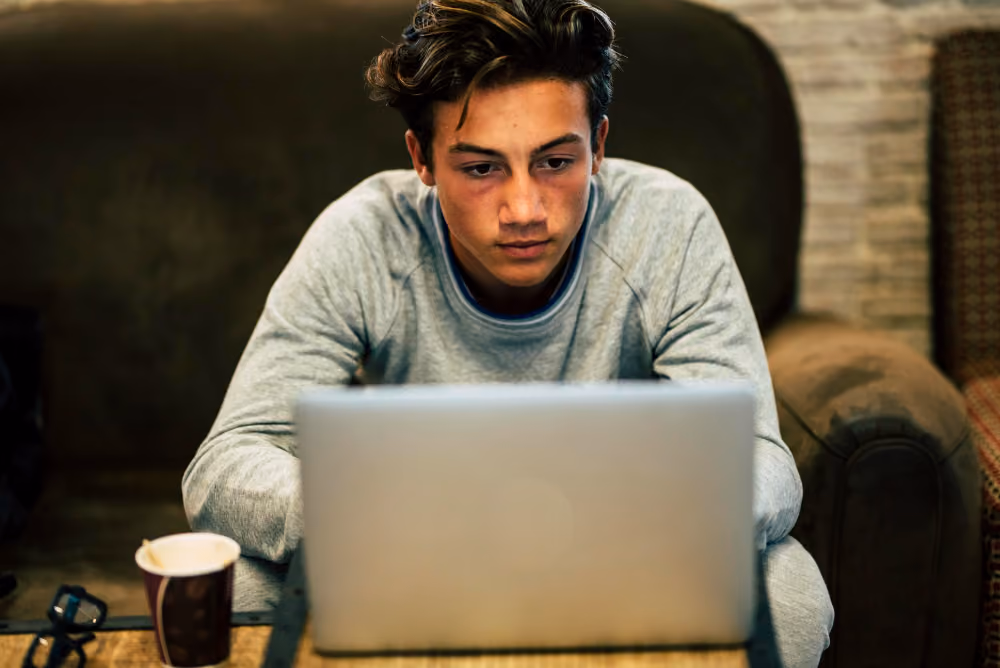 student wearing a blue shirt - Why Is My Essay Detected as AI