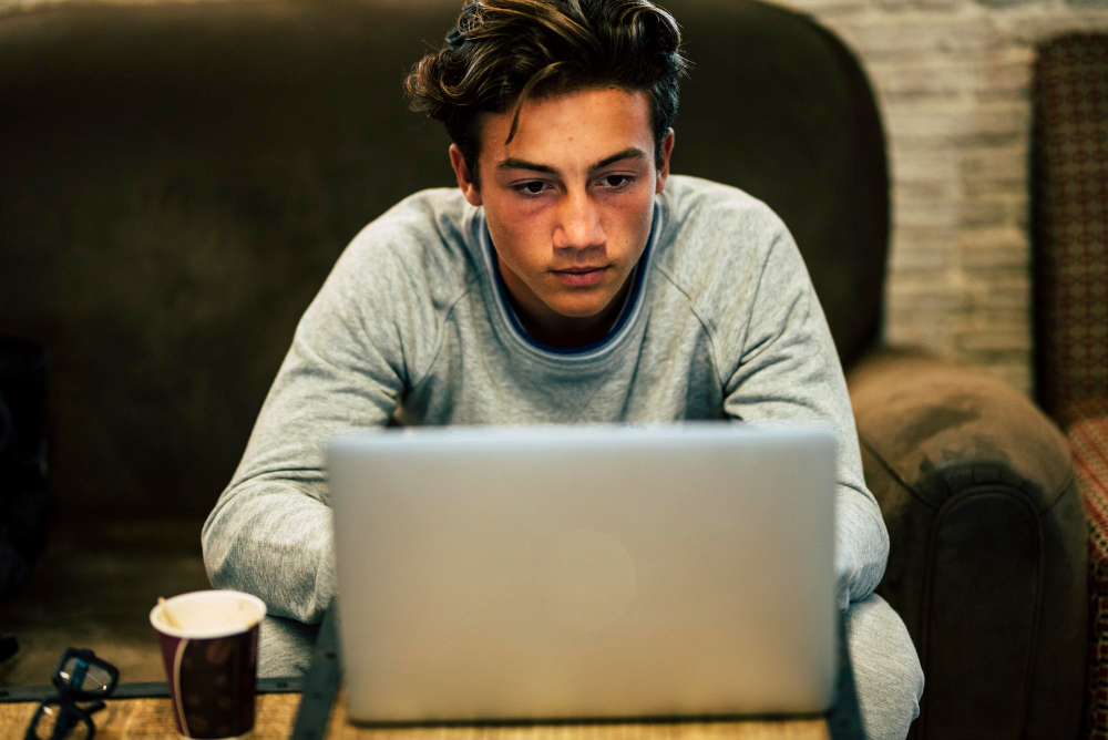 student wearing a blue shirt - Why Is My Essay Detected as AI